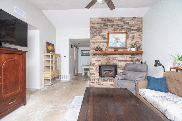 12 Catalpa Ct, Belton, TX 76513 - living area with concrete floors, a ceiling fan, and a wood stove