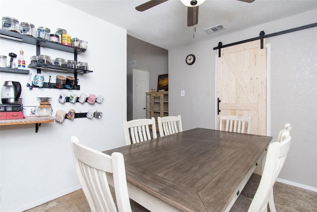 12 Catalpa Ct, Belton, TX 76513 - dining area featuring ceiling fan, a barn door, and baseboards