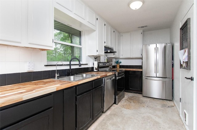 12 Catalpa Ct, Belton, TX 76513 - kitchen with stainless steel appliances, a sink, butcher block counters, and under cabinet range hood