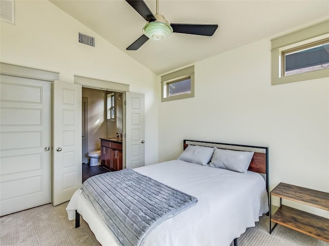 614 Terrell Hill Dr Unit B, Austin, TX 78704 - bedroom with vaulted ceiling, carpet floors, ensuite bathroom, and a ceiling fan