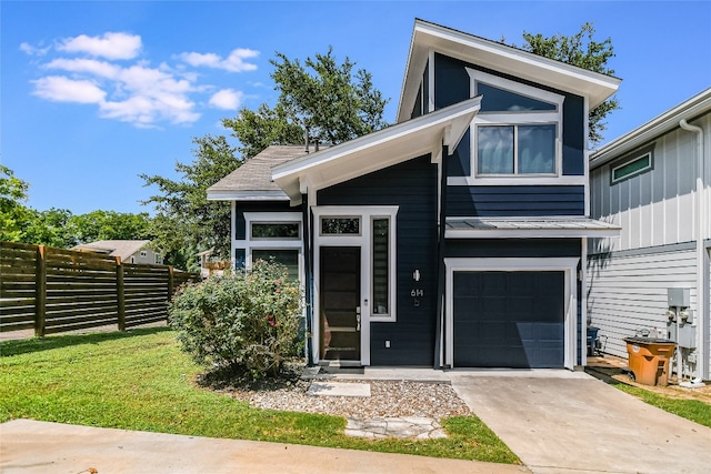 614 Terrell Hill Dr Unit B, Austin, TX 78704 - view of front of property featuring a garage, a standing seam roof, concrete driveway, and a metal roof