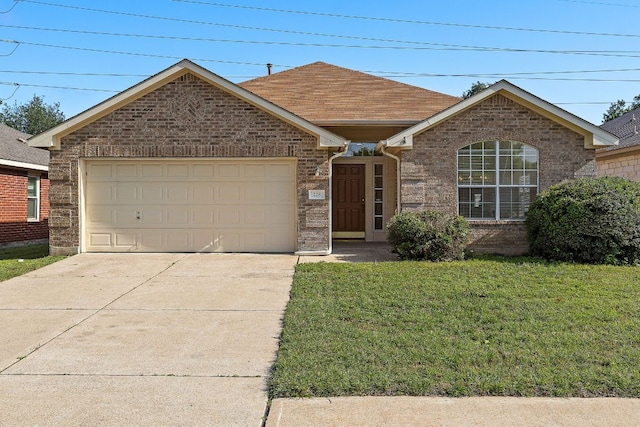 single story home featuring driveway, brick siding, a front lawn, an attached garage, and a shingled roof