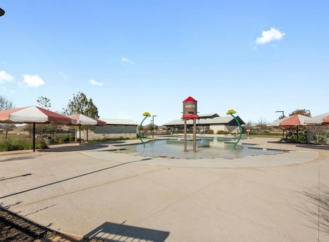 community pool with a water play area