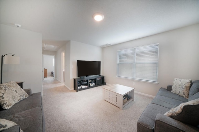 living room with carpet and baseboards