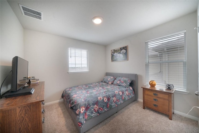 carpeted bedroom with baseboards