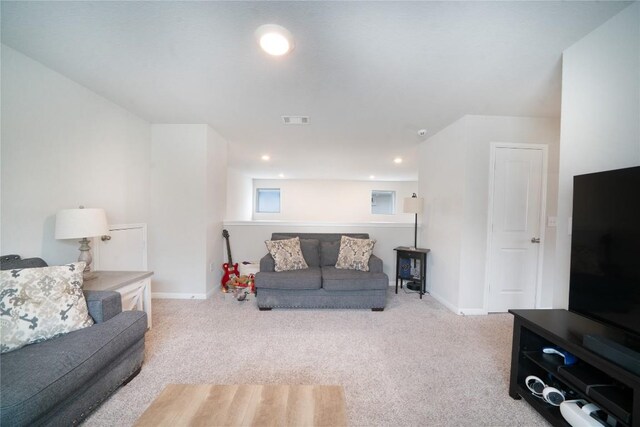 living area featuring carpet, baseboards, and recessed lighting