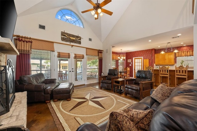 155 Gabriel Farms Dr, Hutto, TX 78634 - living area with ceiling fan, a chandelier, plenty of natural light, french doors, and high vaulted ceiling