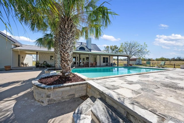 155 Gabriel Farms Dr, Hutto, TX 78634 - swimming pool featuring a shed, a patio area, and an outdoor structure
