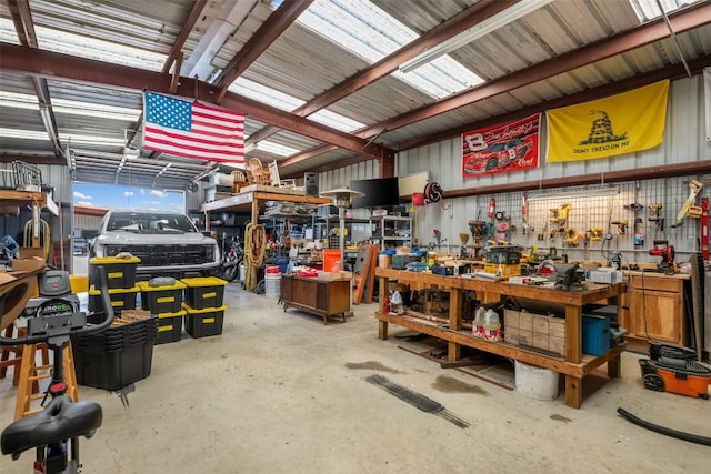 155 Gabriel Farms Dr, Hutto, TX 78634 - miscellaneous room featuring a workshop area and concrete floors