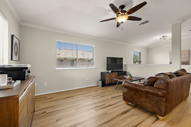 living room with ornamental molding, light wood finished floors, a ceiling fan, baseboards, and lofted ceiling