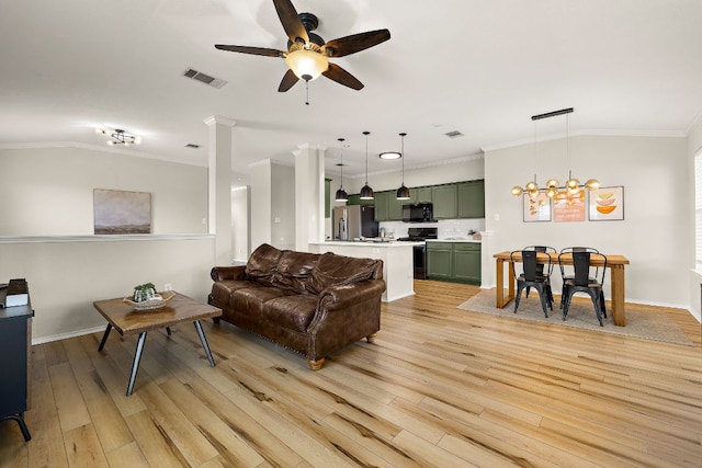 1107 Remington Dr, Leander, TX 78641 - living area featuring a ceiling fan, light wood-style flooring, ornamental molding, baseboards, and lofted ceiling
