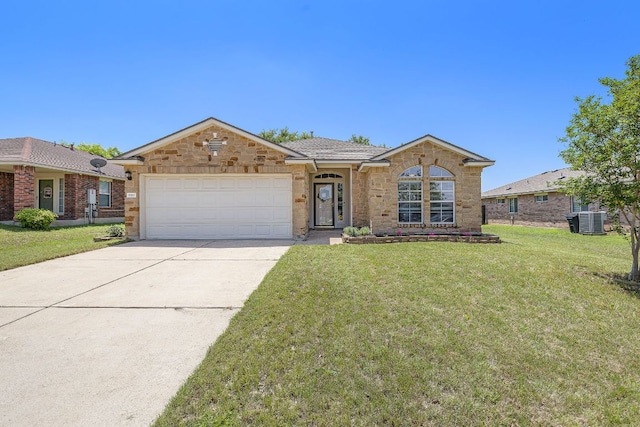 ranch-style home with an attached garage, concrete driveway, a front lawn, stone siding, and cooling unit