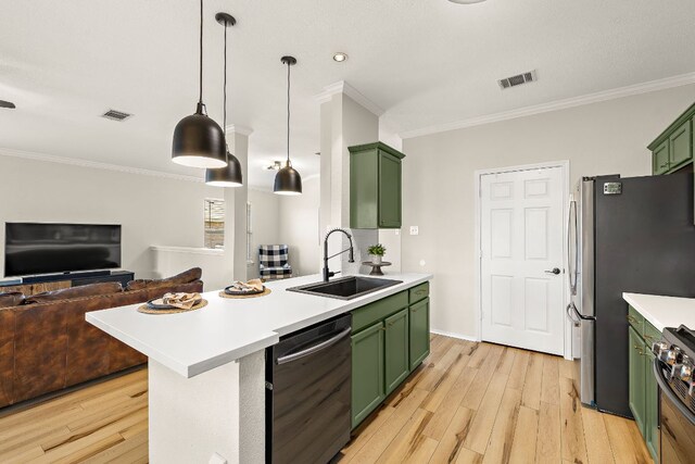 1107 Remington Dr, Leander, TX 78641 - kitchen featuring green cabinets, dishwashing machine, a sink, open floor plan, and crown molding