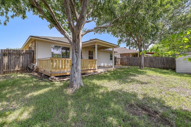 rear view of house with a wooden deck