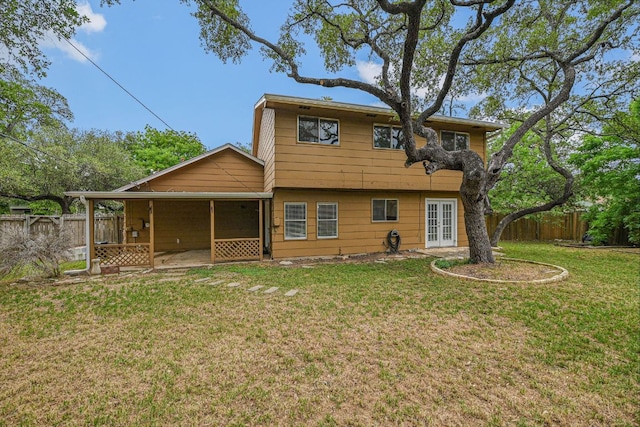 rear view of property featuring french doors and a patio area