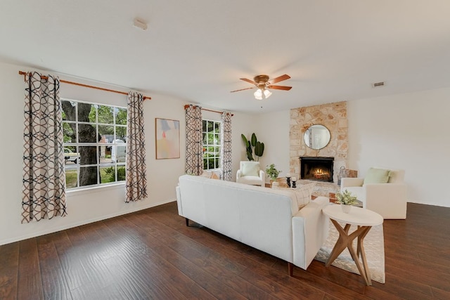 4702 White Elm Dr, Austin, TX 78749 - living area featuring a ceiling fan, a fireplace, and dark wood-style flooring