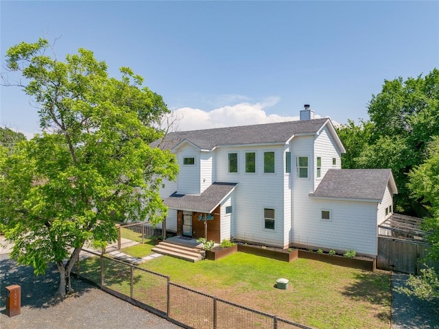 1305 Village W Dr, Austin, TX 78733 - view of front facade with a shingled roof and a chimney