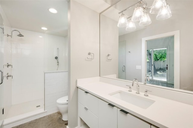 full bath with a shower stall, toilet, vanity, and recessed lighting