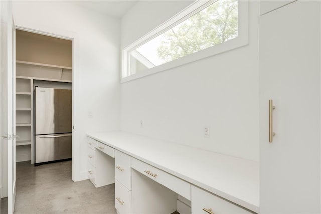 1305 Village W Dr, Austin, TX 78733 - unfurnished office featuring built in desk and concrete floors