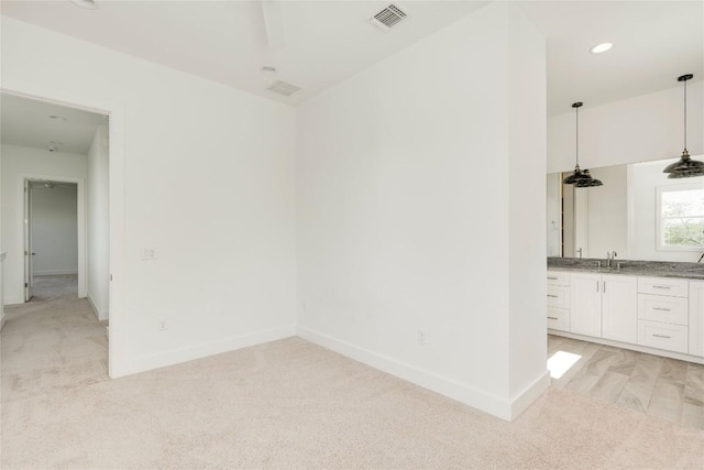 unfurnished room with light colored carpet, baseboards, and recessed lighting