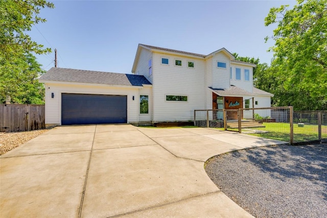 1305 Village W Dr, Austin, TX 78733 - view of front facade featuring a garage and concrete driveway