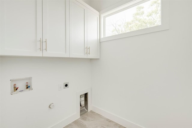 1305 Village W Dr, Austin, TX 78733 - laundry room featuring hookup for an electric dryer, cabinet space, and washer hookup