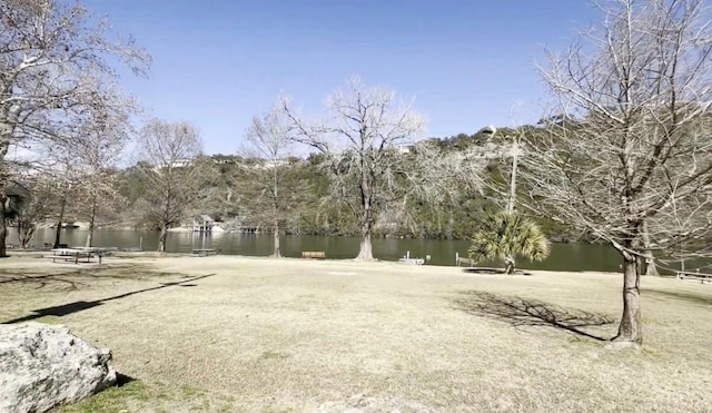 surrounding community featuring a water view