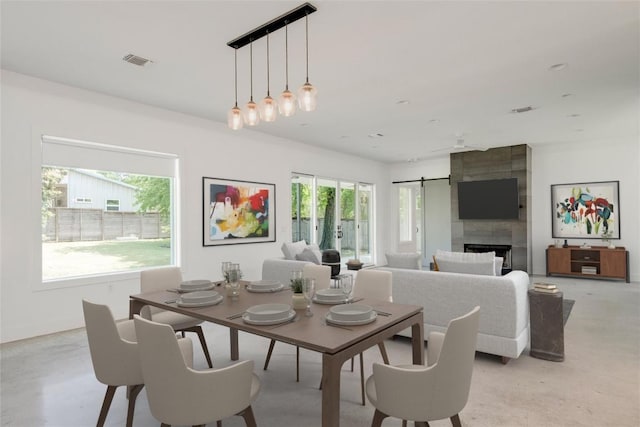 1305 Village W Dr, Austin, TX 78733 - dining room with finished concrete floors