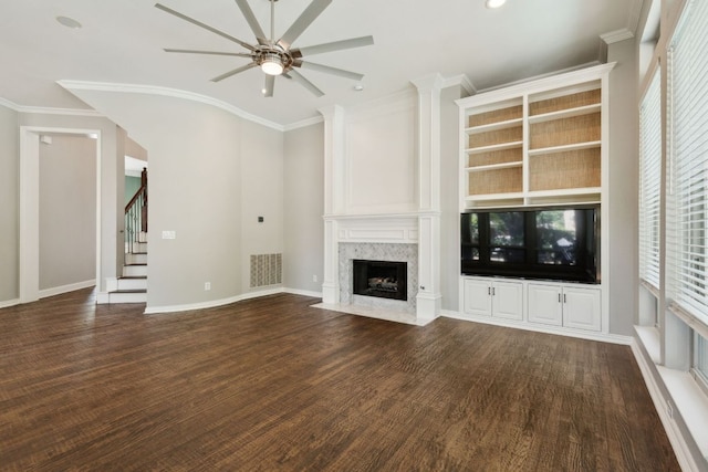 805 Parkwood Ct, Mckinney, TX 75072 - unfurnished living room with ceiling fan, stairway, a high end fireplace, dark wood-type flooring, and ornamental molding