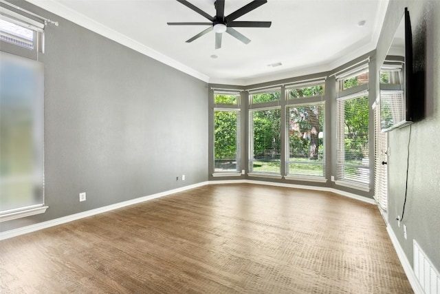 805 Parkwood Ct, Mckinney, TX 75072 - spare room with a ceiling fan, ornamental molding, wood finished floors, and baseboards