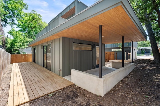 2107 Maple Ave Unit B, Austin, TX 78722 - back of property featuring board and batten siding and a wooden deck