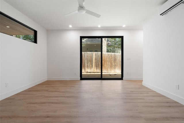 2107 Maple Ave Unit B, Austin, TX 78722 - spare room with an AC wall unit, recessed lighting, ceiling fan, light wood-style floors, and baseboards