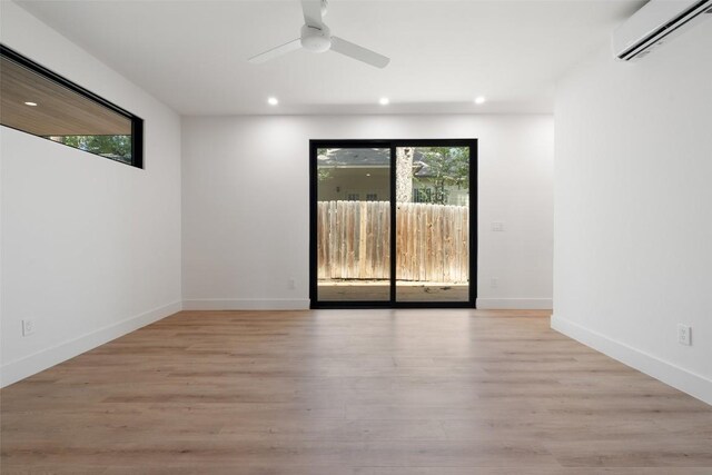2107 Maple Ave Unit B, Austin, TX 78722 - empty room featuring a wall mounted AC, recessed lighting, ceiling fan, and light wood finished floors