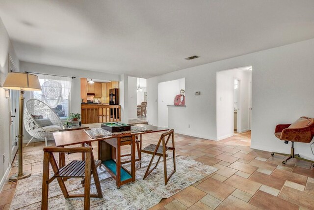 11007 Grapevine Ln, Austin, TX 78759 - dining space with baseboards and light stone finish flooring