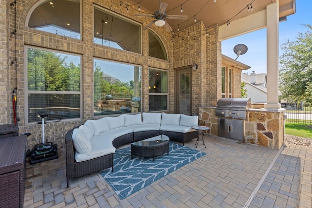 view of patio / terrace with a grill, exterior kitchen, a ceiling fan, an outdoor hangout area, and fence