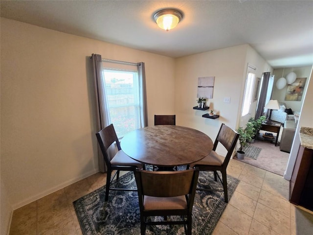 336 Farmer Ln, Jarrell, TX 76537 - dining area with light tile patterned floors and baseboards