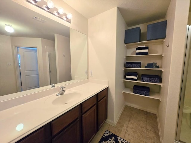 336 Farmer Ln, Jarrell, TX 76537 - full bath featuring vanity, baseboards, an enclosed shower, and tile patterned floors