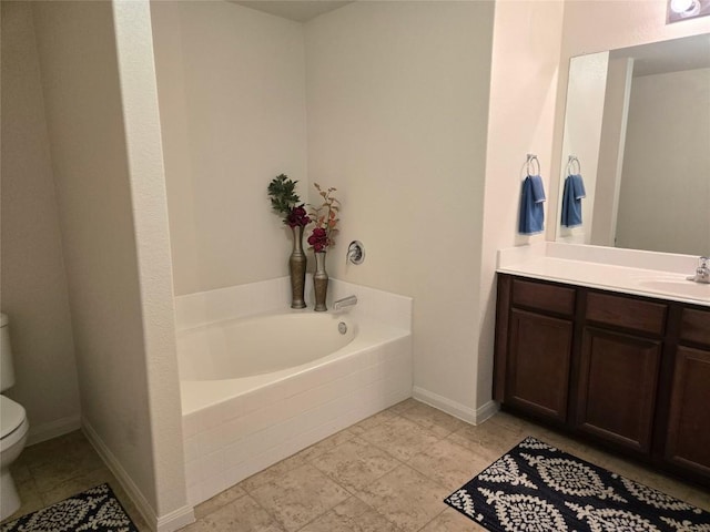 336 Farmer Ln, Jarrell, TX 76537 - bathroom featuring toilet, a bath, vanity, and baseboards