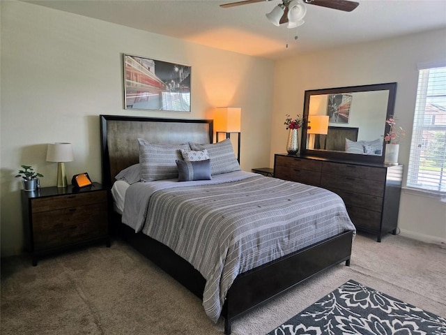 336 Farmer Ln, Jarrell, TX 76537 - bedroom with light carpet, a ceiling fan, and baseboards