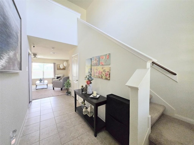 336 Farmer Ln, Jarrell, TX 76537 - hall featuring stairway, light tile patterned floors, and baseboards