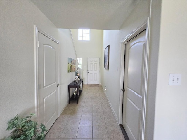 336 Farmer Ln, Jarrell, TX 76537 - hall featuring light tile patterned floors and baseboards
