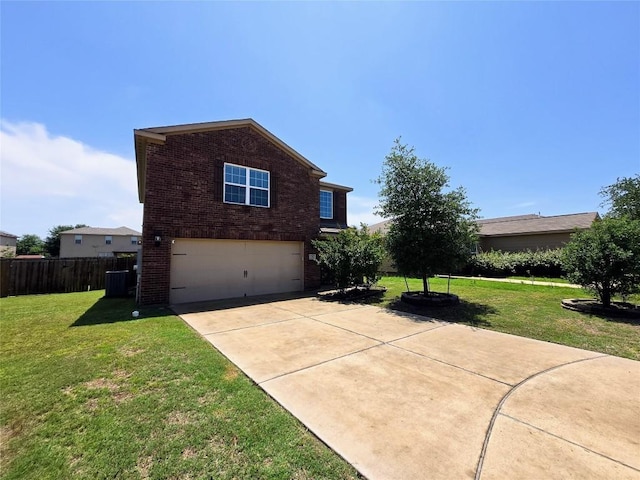 336 Farmer Ln, Jarrell, TX 76537 - view of home's exterior featuring brick siding, a garage, and driveway