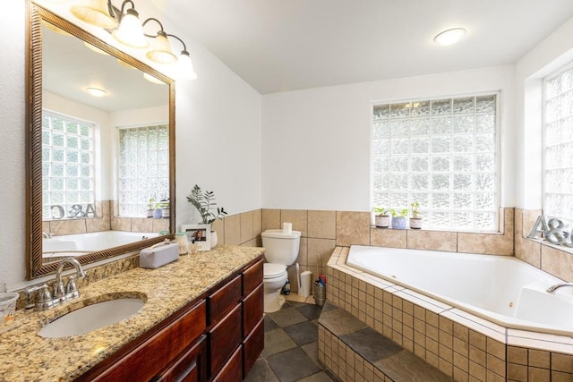 176 Old Lexington Rd Unit C, Elgin, TX 78621 - full bath with plenty of natural light, a jetted tub, vanity, and tile patterned flooring