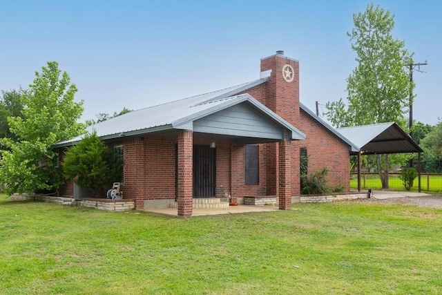176 Old Lexington Rd Unit C, Elgin, TX 78621 - back of property featuring a lawn, brick siding, and a chimney