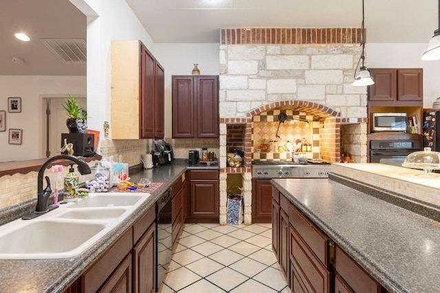 176 Old Lexington Rd Unit C, Elgin, TX 78621 - kitchen with black appliances, tasteful backsplash, light tile patterned flooring, dark countertops, and arched walkways