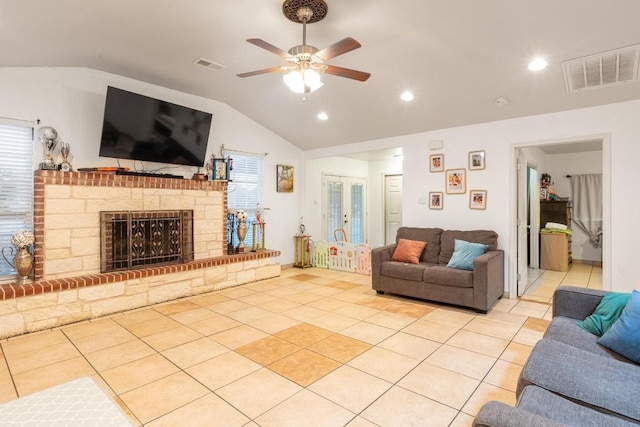 176 Old Lexington Rd Unit C, Elgin, TX 78621 - living area with vaulted ceiling, ceiling fan, light tile patterned floors, plenty of natural light, and a fireplace with raised hearth