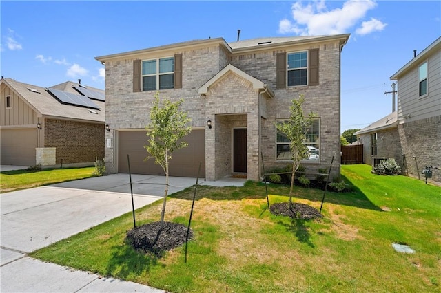 206 Duroc Dr, Hutto, TX 78634 - traditional-style house with a garage, brick siding, and concrete driveway