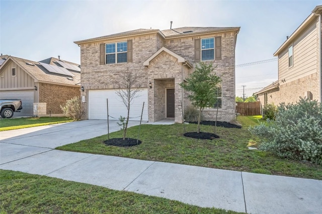 206 Duroc Dr, Hutto, TX 78634 - traditional-style home with brick siding, driveway, and a garage