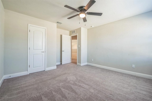 206 Duroc Dr, Hutto, TX 78634 - unfurnished bedroom with carpet floors, baseboards, and ceiling fan