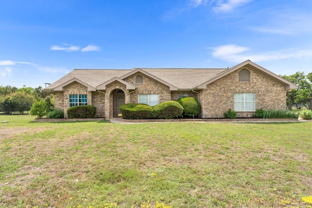 221 Breakaway Rd, Cedar Park, TX 78613 - single story home with a front yard, a shingled roof, and brick siding